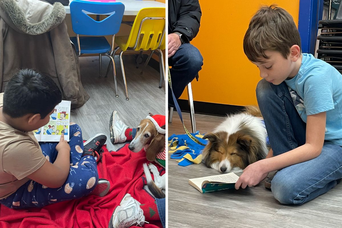 Two children sit on the floor reading books aloud to therapy dogs during the Boys & Girls Club of Rockford's reading with dogs program.