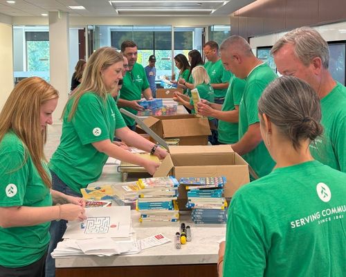 Associated Bank employees assembling literacy kids for United Way Rock River Valley