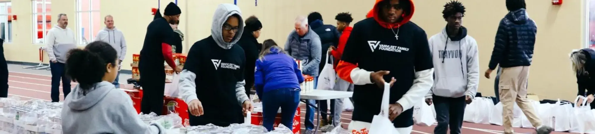 VanVleet volunteers work distribution tables at Auburn High School