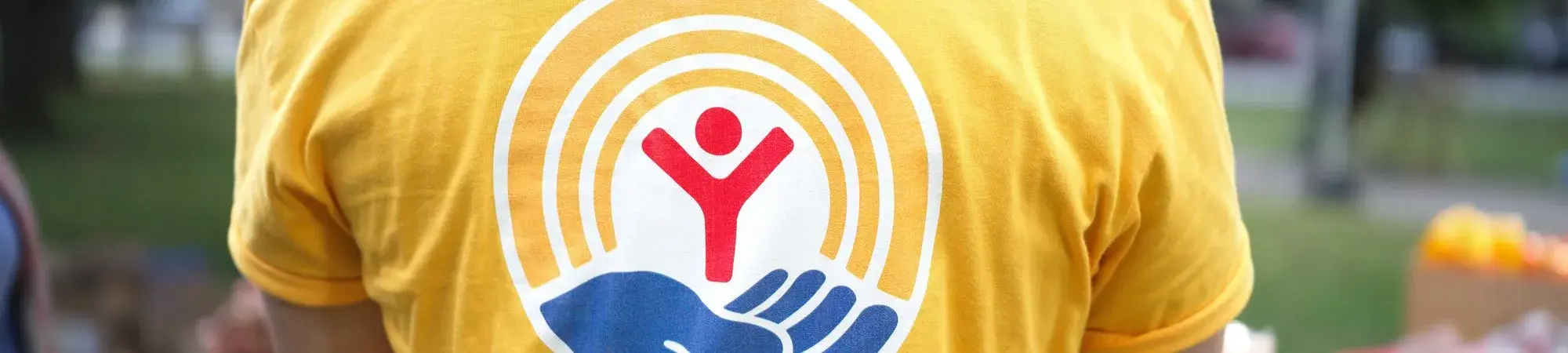 United Way logo on a bright yellow tshirt